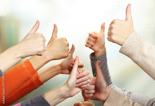Photo: Human hands on bright background Human hands on bright background