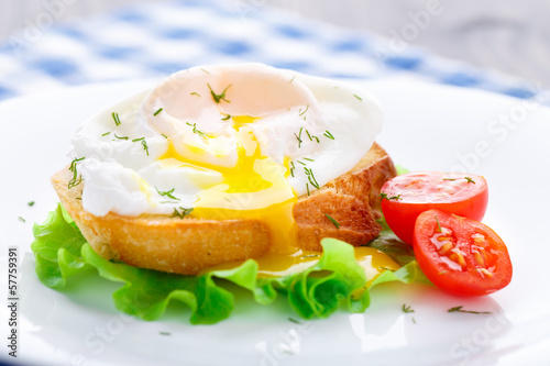 Photo: Poached egg with dill on bread Poached egg with dill on bread