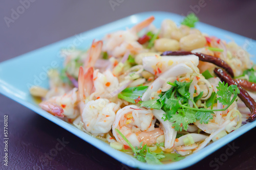 Photo: spicy salad on blue dish spicy salad on blue dish