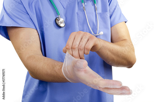 Photo: Doctor puts gloves Doctor puts gloves
