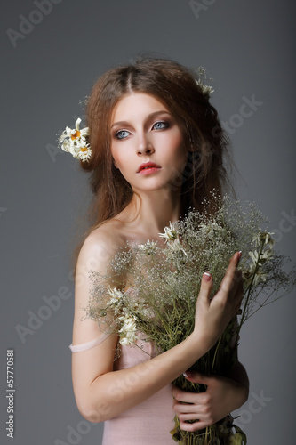 Photo: Sentimentality. Redhaired Muse with Flowers in Dreams Sentimentality. Redhaired Muse with Flowers in Dreams