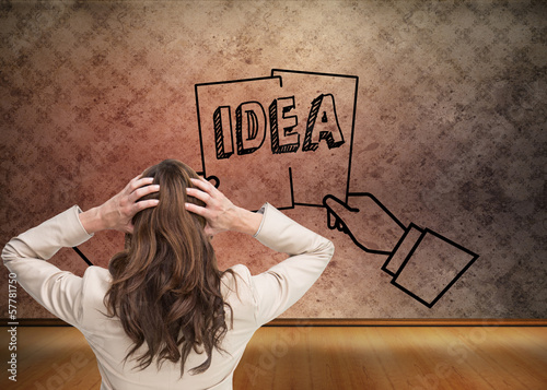 Photo: Composite image of young classy businesswoman with hands on head Composite image of young classy businesswoman with hands on head