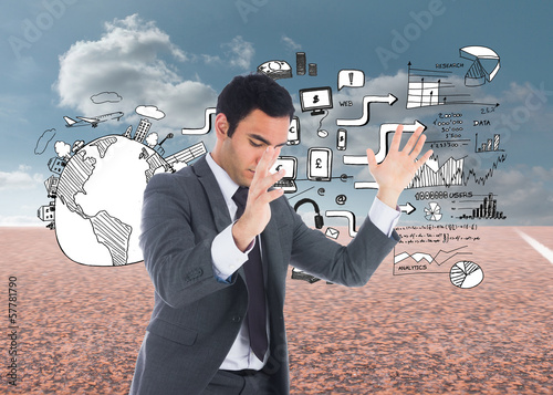Photo: Composite image of unsmiling businessman catching Composite image of unsmiling businessman catching