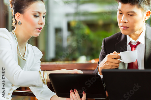Photo: Two Asian Chinese business people Two Asian Chinese business people