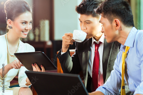 Photo: Chinese business people t presentation meeting Chinese business people t presentation meeting
