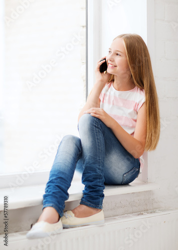 Photo: girl with smartphone at school girl with smartphone at school