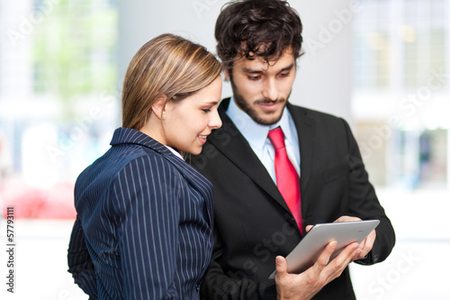 Photo: Business people using a tablet Business people using a tablet
