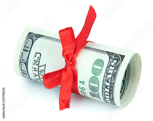 Photo: Dollars with gift bow isolated on white Dollars with gift bow isolated on white