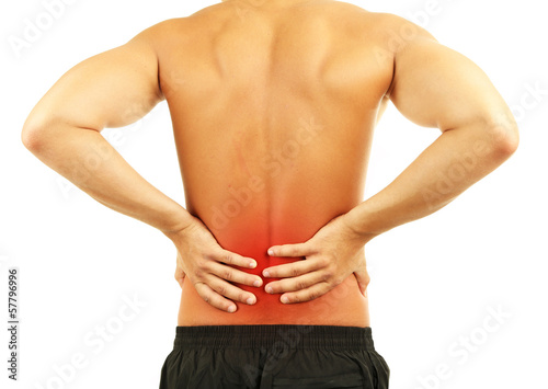 Photo: Young man with back pain, isolated on white Young man with back pain, isolated on white