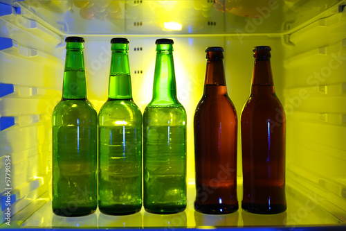 Photo: Bottles with drinks in refrigerator Bottles with drinks in refrigerator