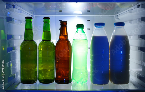 Photo: Bottles with drinks in refrigerator Bottles with drinks in refrigerator