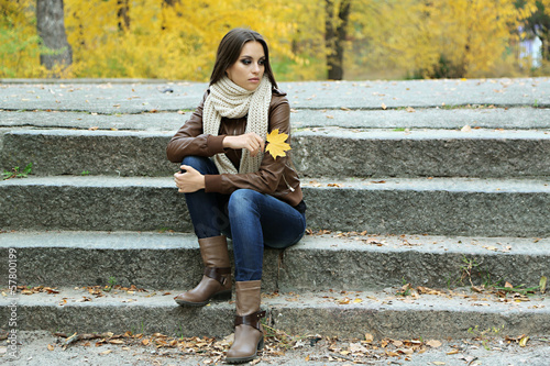 Photo: Young lonely woman outdoors Young lonely woman outdoors