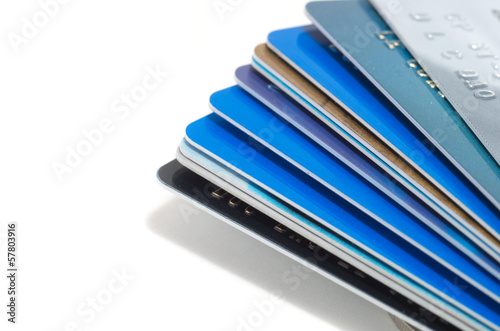 Photo: Stack of credit cards isolated on white background Stack of credit cards isolated on white background