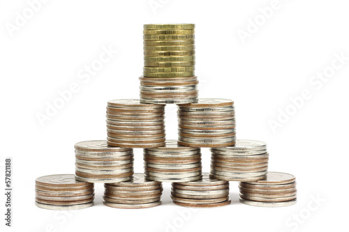 Photo: Stacks of coins stacked in a pyramid on a white background Stacks of coins stacked in a pyramid on a white background