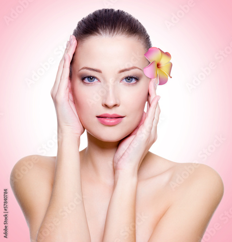 Photo: young woman with healthy clean skin of face young woman with healthy clean skin of face