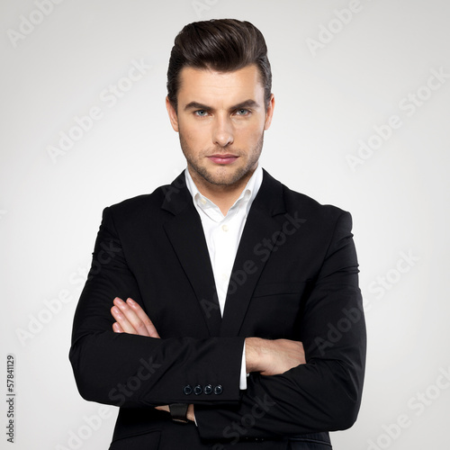 Photo: Fashion young businessman in black suit Fashion young businessman in black suit