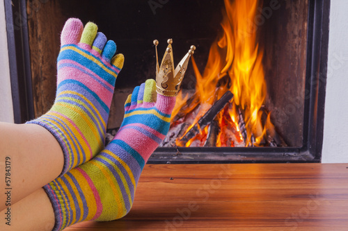 Photo: relaxing at fireplace in colorful funny toesocks relaxing at fireplace in colorful funny toesocks