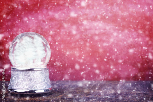 Photo: Empty Snowglobe Against Red Empty Snowglobe Against Red