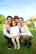 Cute family portrait of 4 people