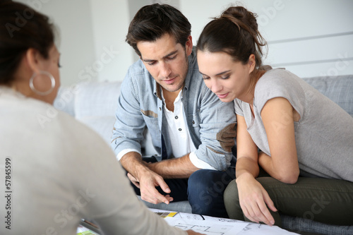 Photo: Couple meeting architect for house construction Couple meeting architect for house construction