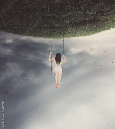 Photo: Surreal swing with woman Surreal swing with woman