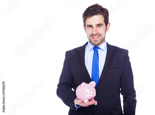 Photo: Businessman holding a piggy bank, isolated on a white background Businessman holding a piggy bank, isolated on a white background