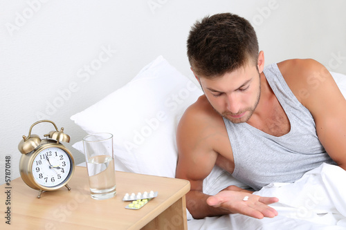 Photo: Handsome young man in bed Handsome young man in bed
