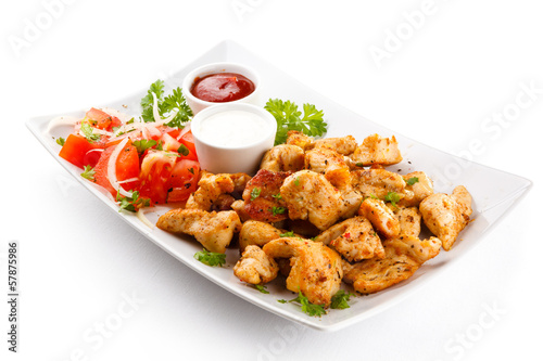 Photo: Grilled meat and vegetables on white background Grilled meat and vegetables on white background