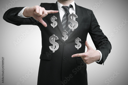 Photo: businessman with dollars symbol businessman with dollars symbol