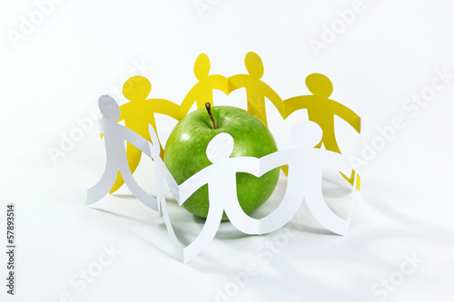Photo: circle of paper people around the green apple circle of paper people around the green apple