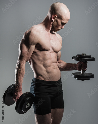 Photo: fit male with dumbells fit male with dumbells