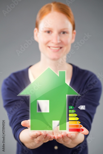 Photo: Woman with an Energy Efficient Green House Woman with an Energy Efficient Green House