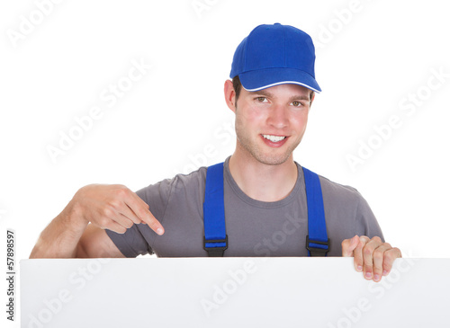 Photo: Male Worker Holding Blank Placard Male Worker Holding Blank Placard