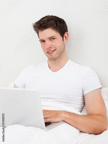 Photo: Man Using A Laptop Man Using A Laptop