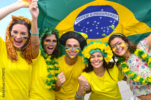 Photo: Group of happy brazilian soccer fans commemorating victory. Group of happy brazilian soccer fans commemorating victory.