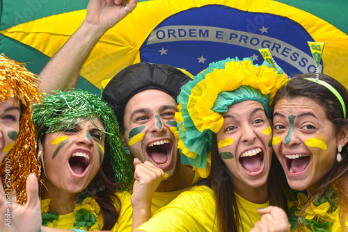 Photo: Group happy brazilian soccer fans commemorating victory. Group happy brazilian soccer fans commemorating victory.