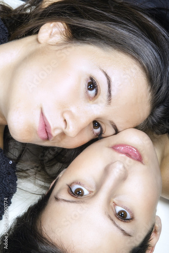 Photo: Two beautiful young girls face-to-face portrait color image Two beautiful young girls face-to-face portrait color image