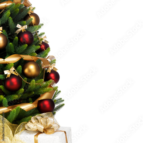 Photo: Magically decorated Christmas Tree with balls, ribbons and golde Magically decorated Christmas Tree with balls, ribbons and golde