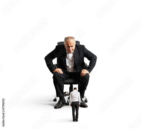 Photo: big boss looking at small bad worker big boss looking at small bad worker