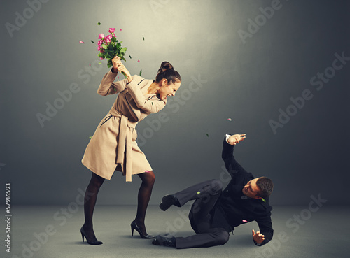 Photo: woman yelling at frightened man woman yelling at frightened man