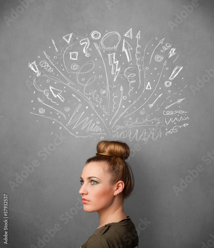 Photo: Young woman thinking with sketched arrows above her head Young woman thinking with sketched arrows above her head