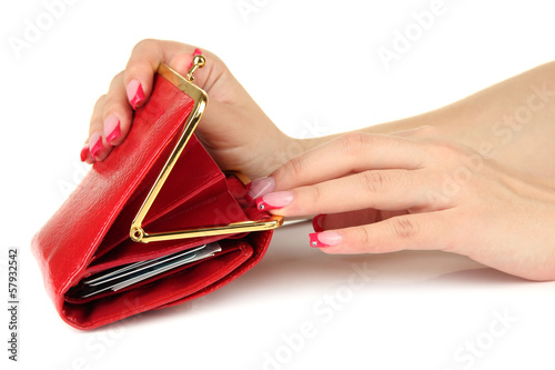 Photo: Female hand holding red purse, isolated on white Female hand holding red purse, isolated on white