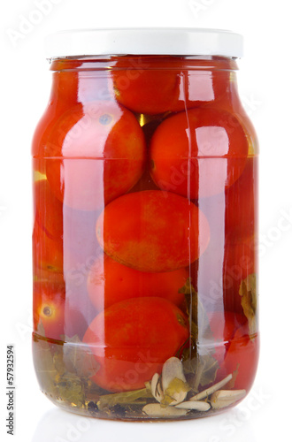 Photo: Tasty canned tomatoes in glass jar, isolated on white Tasty canned tomatoes in glass jar, isolated on white