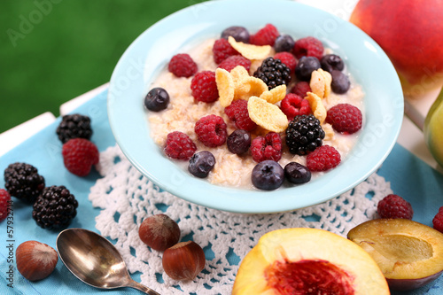 Photo: Oatmeal in plate with berries Oatmeal in plate with berries