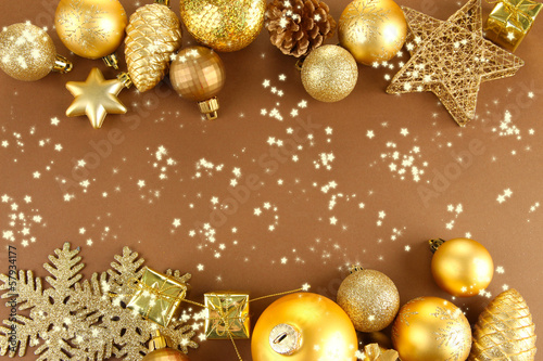Photo: Beautiful Christmas decorations on brown background Beautiful Christmas decorations on brown background