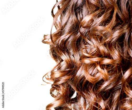 Photo: Hair isolated on white. Border of Curly Brown Long Hair Hair isolated on white. Border of Curly Brown Long Hair