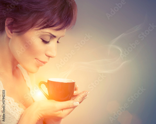 Photo: Beautiful Girl Enjoying Coffee. Woman with Cup of Hot Beverage Beautiful Girl Enjoying Coffee. Woman with Cup of Hot Beverage