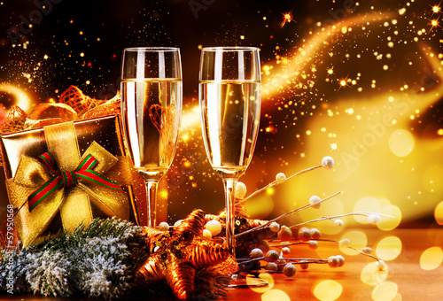Photo: New Year and Christmas Celebration. Two Champagne Glasses New Year and Christmas Celebration. Two Champagne Glasses
