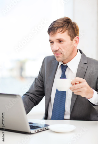 Photo: businessman working with laptop computer businessman working with laptop computer