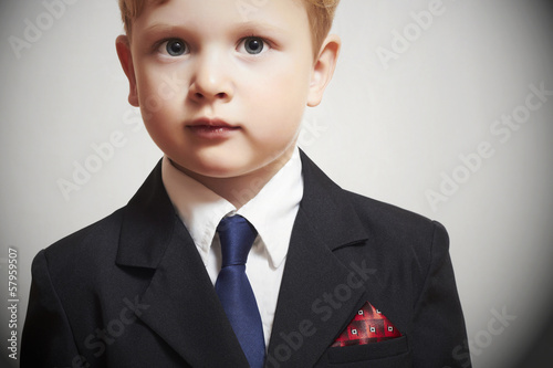 Photo: fashionable little boy in suite.business kid.children.manager fashionable little boy in suite.business kid.children.manager